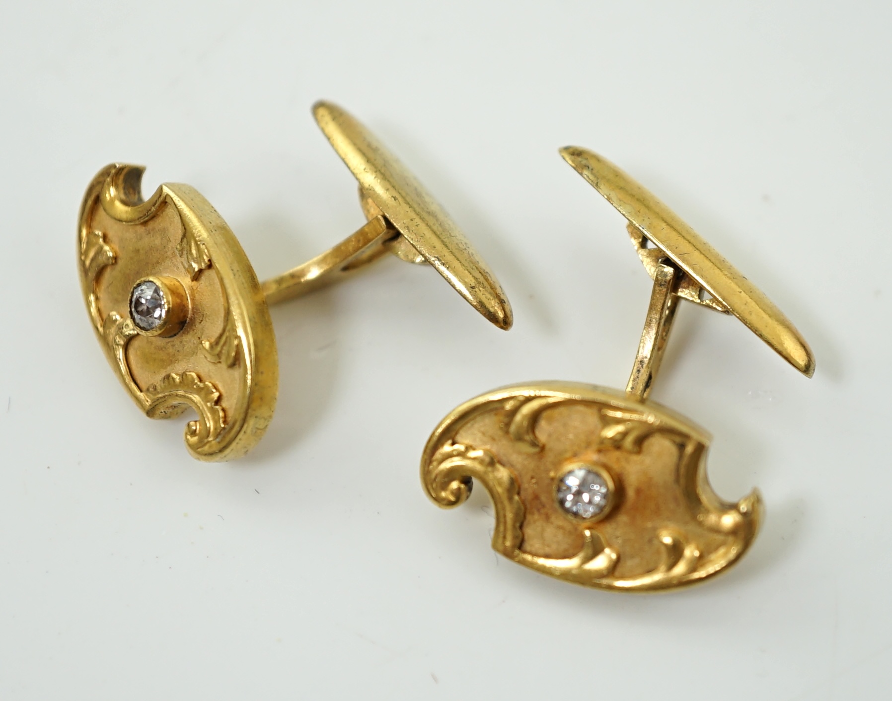 A pair of Russian 56 zolotnik gold and solitaire diamond set cufflinks